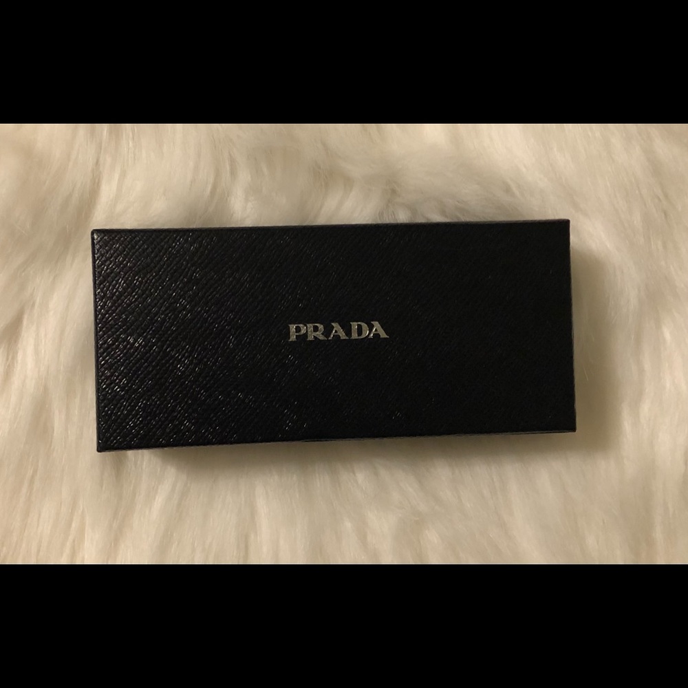 Rectangular, navy blue Prada box